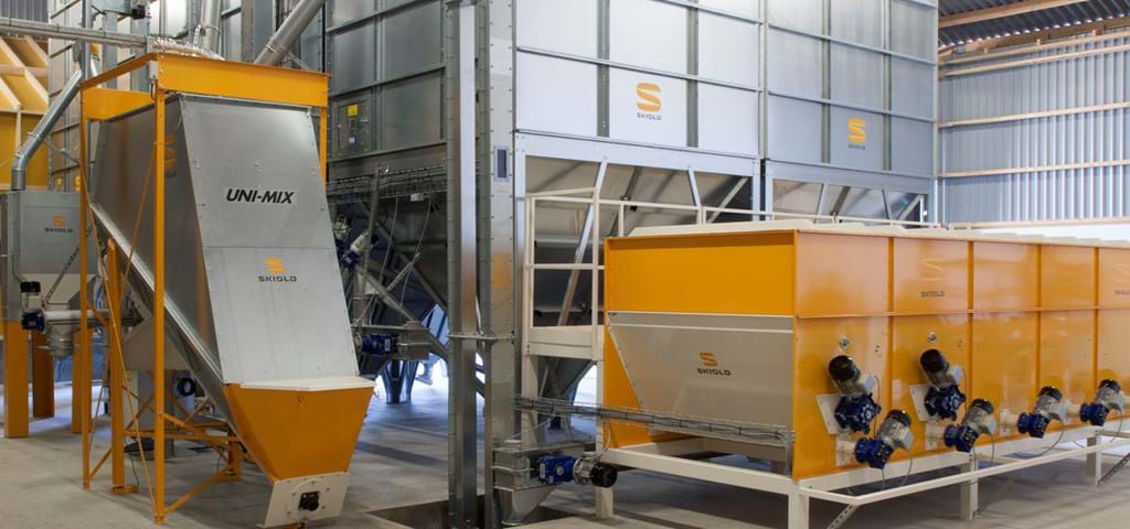 SKIOLD feed mill with mineral hoppers, cleaner and unimix inclined mixer
