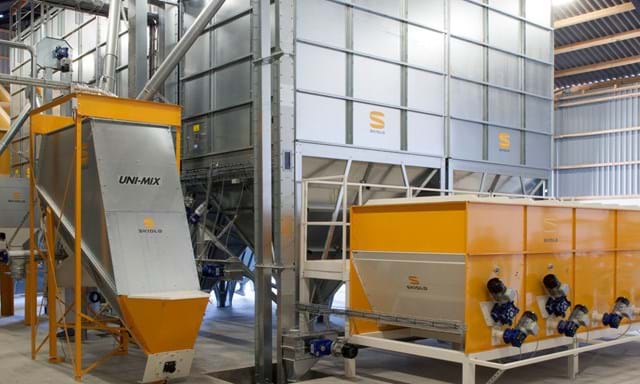 SKIOLD feed mill with mineral hoppers, cleaner and unimix inclined mixer